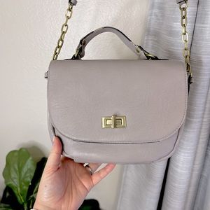 Crossbody Merona lavender bag with gold hardware.